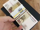 Пачка новых 100рублевых банкнот Банка России